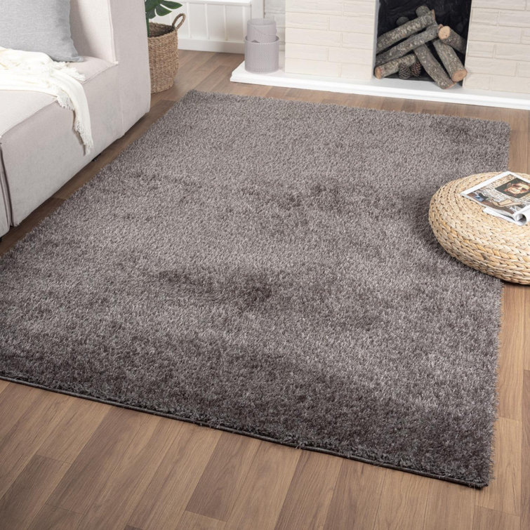 Tapis noir uni tissé à la machine 5 pi x 7 pi