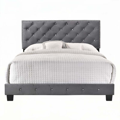 Lit rembourré en velours avec tête de lit capitonnée, parfait pour une expérience de sommeil élégante et confortable