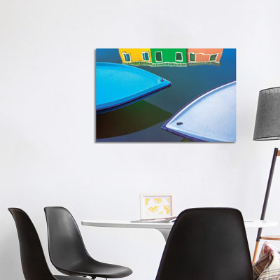 Italy, Burano. Boat Bows And House Reflection In Canal. by Jaynes Gallery - Wrapped Canvas Print