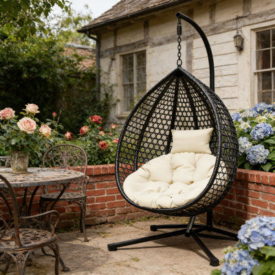 Sturdy Hammock Chair with Stand, Durable Rattan Weave and Removable Cushion for Indoor Outdoor Use.