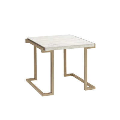 Table de bout de style traîneau avec plateau en pierre reconstituée couleur champagne Luthersville