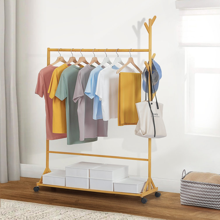 https://assets.wfcdn.com/im/20794136/resize-h755-w755%5Ecompr-r85/2004/200484827/Sliding+Coat+Rack+Bamboo+Clothing+Stand%2C+Wheeled+Caster+Garment+Clothes+Organizer%2C+for+Living+Room.jpg