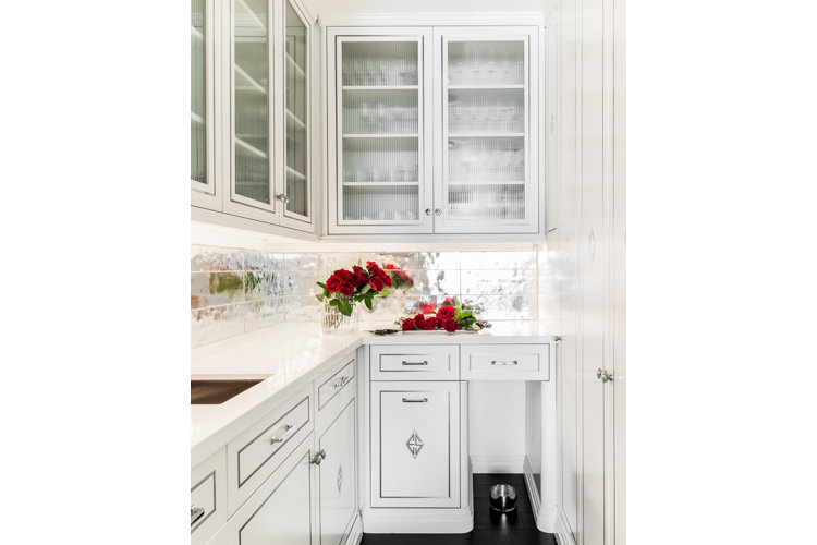 Galley kitchen with clear glass cabinets