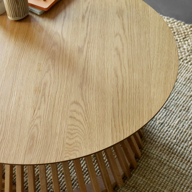 Dejania Pedestal Coffee Table, Natural Wood
