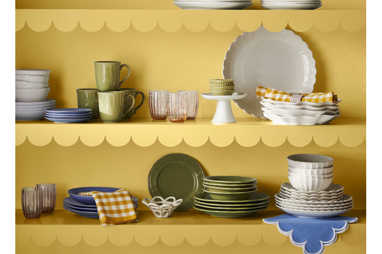 how to organize your kitchen cabinets dinnerware and serveware organized and stacked on yellow cabinet shelves