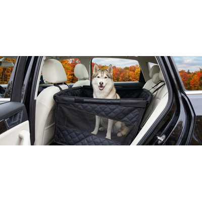Large dog back seat extender featuring breathable mesh windows; provides robust support and protection; functions as a seat cover for cars, trucks, and SUVs; finished in black and silver.
