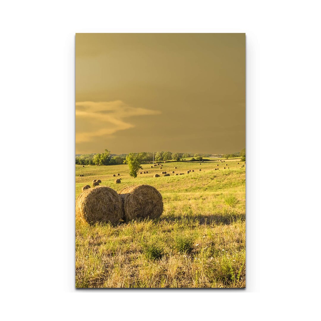 Leinwandbild Heuballen auf einem Feld in der Toskana