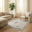 Tapis à motif géométrique marocain beige Thambiah-558934877