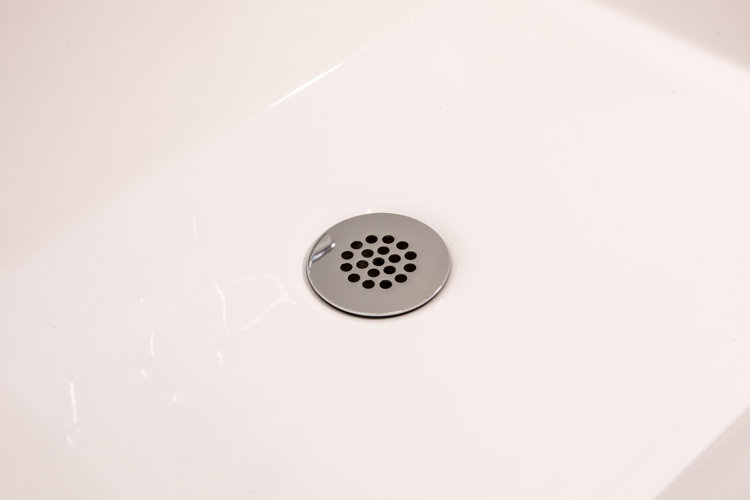 closeup of a chrome finish grid drain