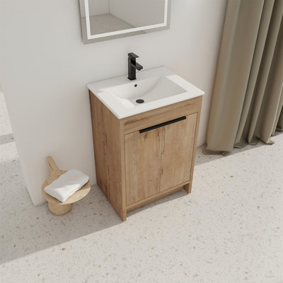 Meuble-lavabo autoportant 24 po avec lavabo en céramique blanche et 2 portes d'armoire à fermeture en douceur