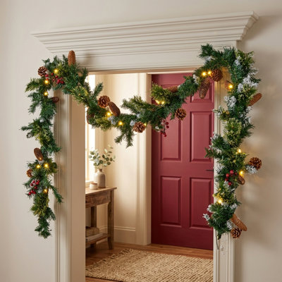 9' Pre-Lit Artificial Christmas Garland with Warm White LED Lights, Faux Pine Greenery with Berry Clusters and Pine Cones for Mantel, Fireplace & Staircase Decor