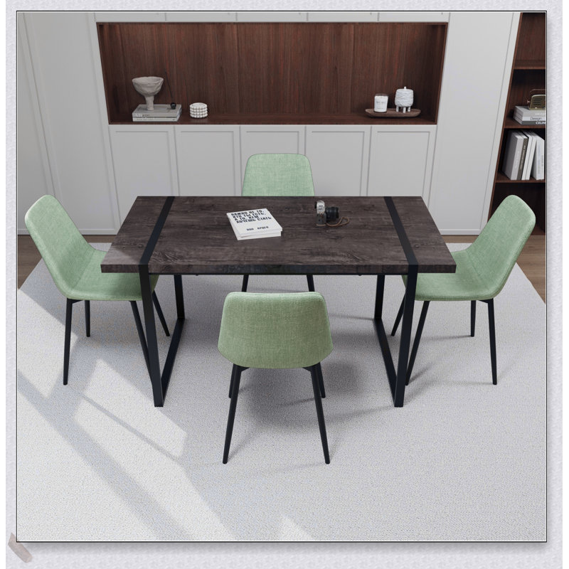 Ensemble de salle à manger moderne 4 pièces avec table en bois aggloméré noir, base en métal rectangulaire et chaises en suède confortables pour des repas élégants