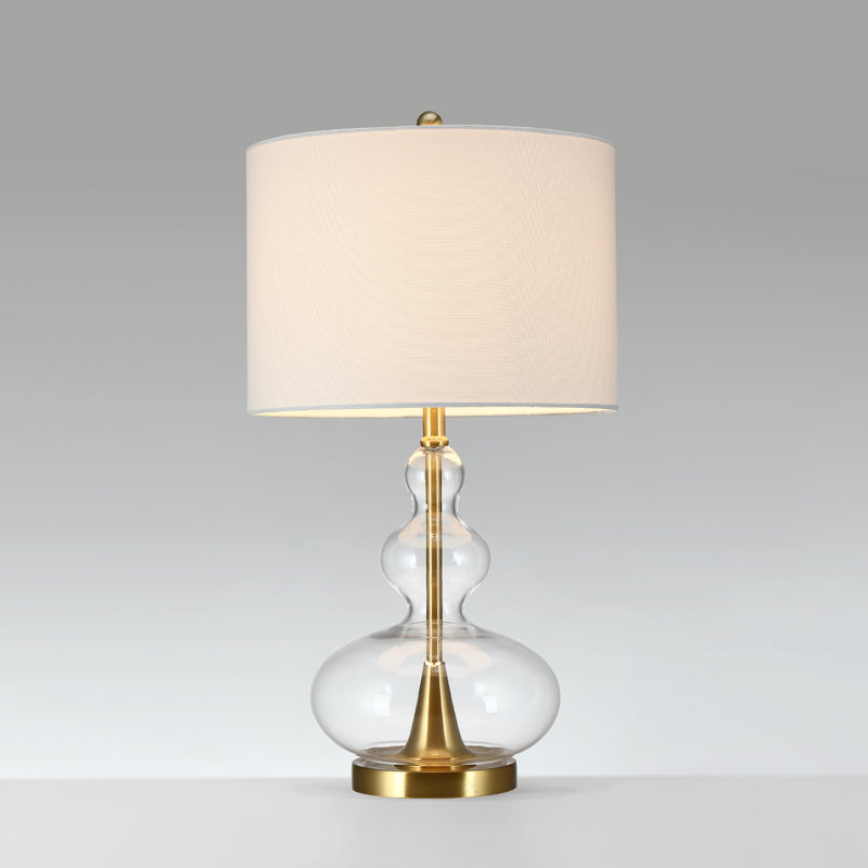 Lampe de table en verre avec base en laiton et abat-jour tambour blanc