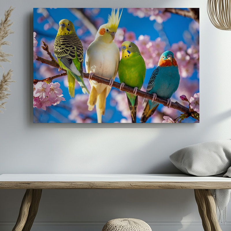 Toile dans un cadre extérieur serein, perchoir à quatre oiseaux aux couleurs vives sur une branche élancée texturée ornée d'une toile rose délicate