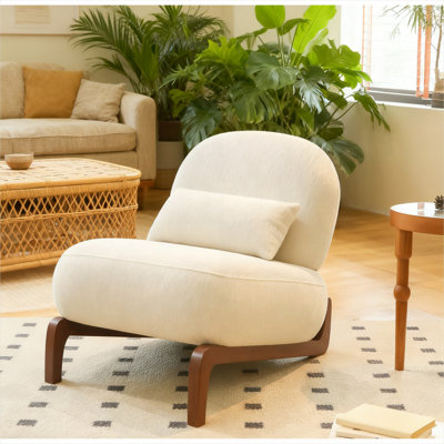 Fauteuil de chambre moderne sans accoudoirs à dossier arrondi avec pieds en bois massif et revêtement en velours doux