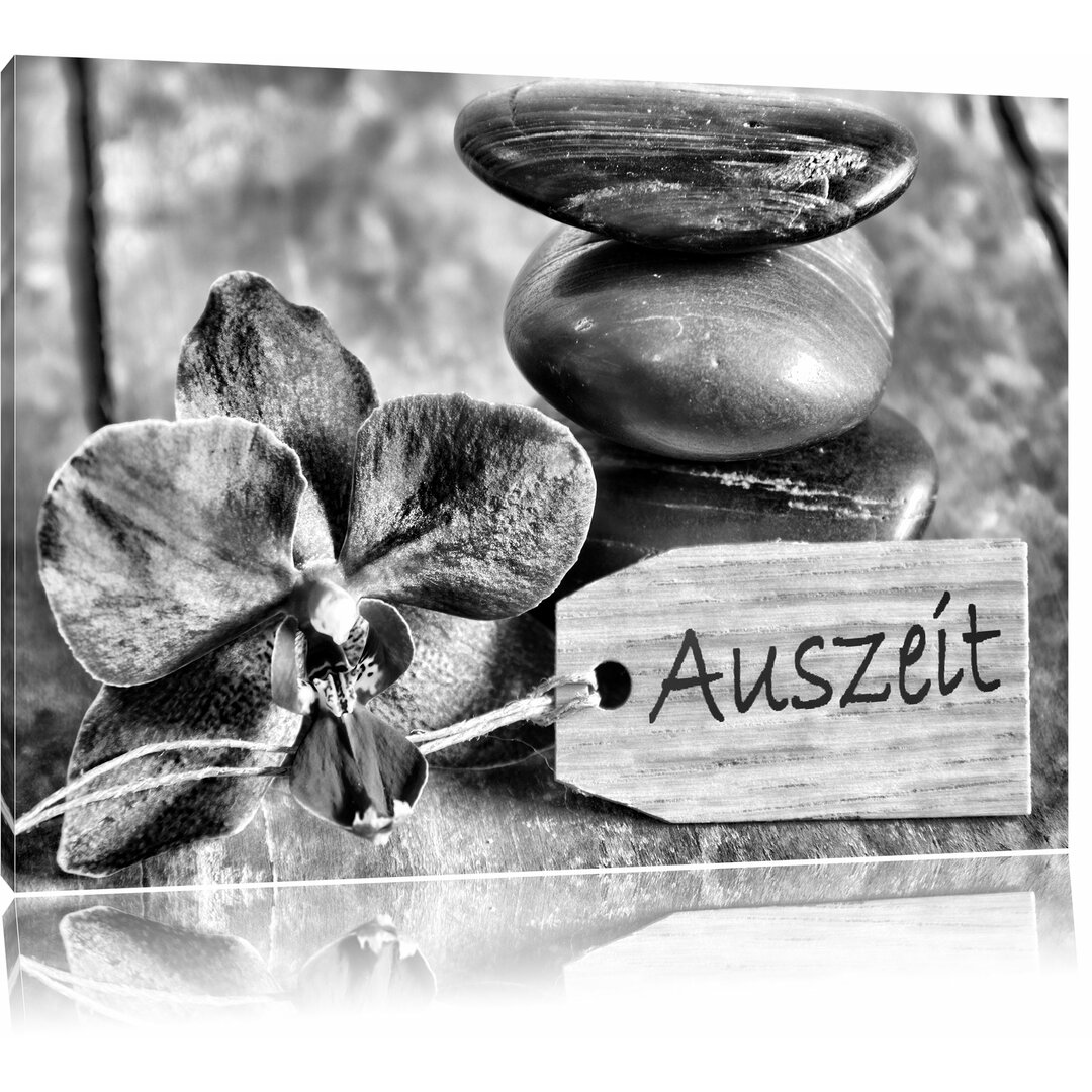 Leinwandbild Auszeit Orchidee mit Zen Steinen in Monochrom