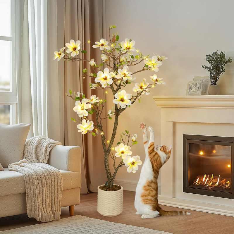 Magnolia artificiel avec des fleurs blanches réalistes et des feuilles vertes luxuriantes
