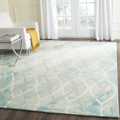 Tapis vert / ivoire touffeté à la main à motif géométrique Amekia