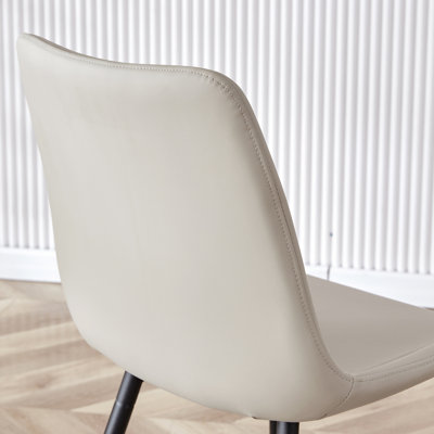 Light gray artificial leather backrest cushion dining chair, black metal legs, curved widened cushion design for more comfort