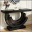 Console de luxe moderne avec base en demi-lune miroir et finitions glamour effet diamant.
