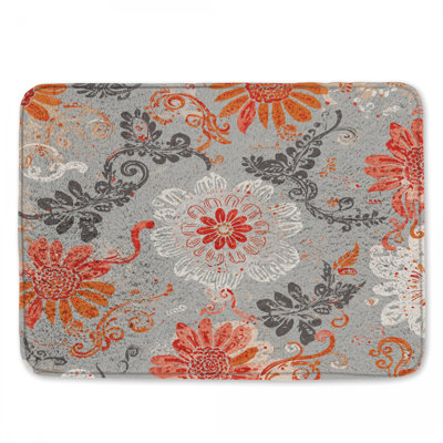 Tapis de bain orange à motif floral gris