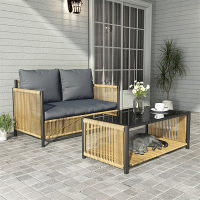 Charming Outdoor Wicker Sofa Set With Cushions And Table For Relaxing Moments