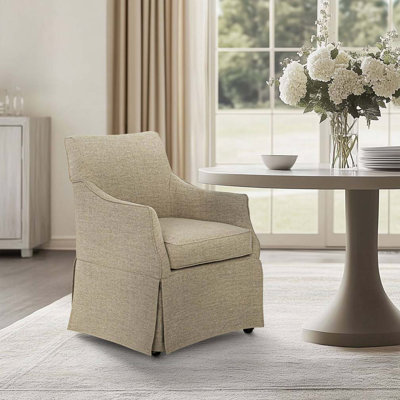 Fauteuil rembourré à jupe avec roulettes cachées