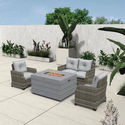 Schwerin Wicker 4 - Person Patio Conversation Set with Cushions