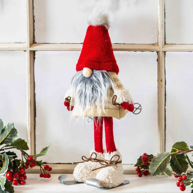 Tissu gnome de ski avec chapeau rouge
