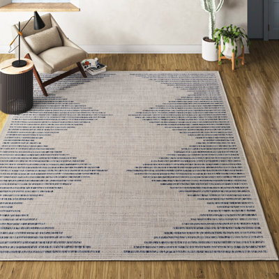 Calliah Striped Polypropylene Area Rug in Blue/Cream