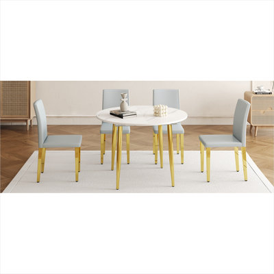 Table de salle à manger extensible ronde en panneau de fibres à densité moyenne et 4 chaises en polyuréthane gris, avec pieds dorés, extension ovale peu encombrante pour la cuisine