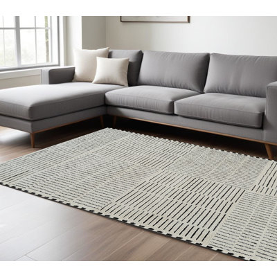 7' X 10' Cream and Black Abstract Distressed Area Rug