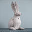 Statue de lapin en ciment patiné