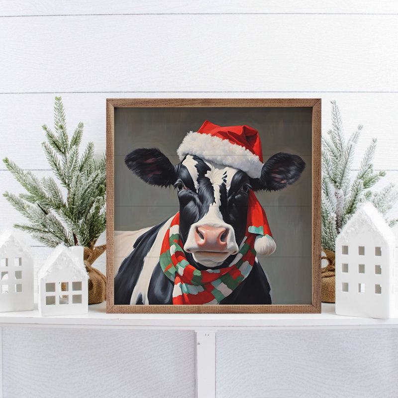 Vache laitière avec chapeau et écharpe Santa