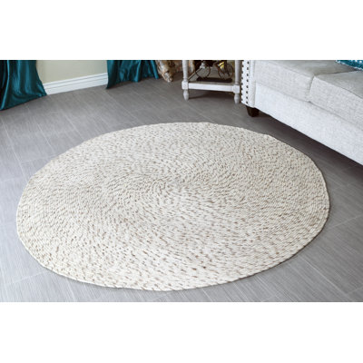 Tapis décoratif en laine tressée à la main de couleur beige ronde Galilhai