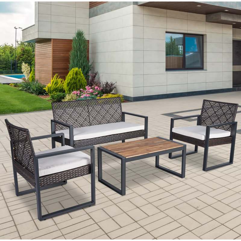 Ensemble de mobilier de patio 4 pièces avec table en bois d'acacia et canapé rembourré en rotin