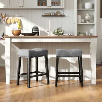 Oenone Backless Bar Stools, Upholstered Saddle Seat With Nailhead Trim, Weathered Wood Legs - Set of 2