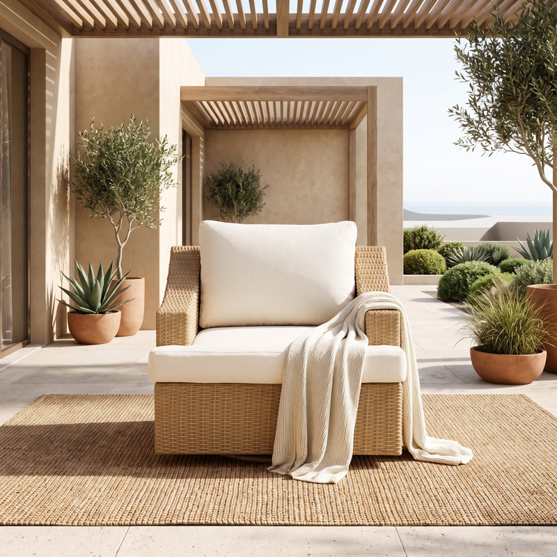 Chaise d'extérieur pivotante en rotin avec coussins