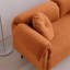 Luxueux canapé en faux agneau avec coussins décoratifs pour une assise élégante et confortable