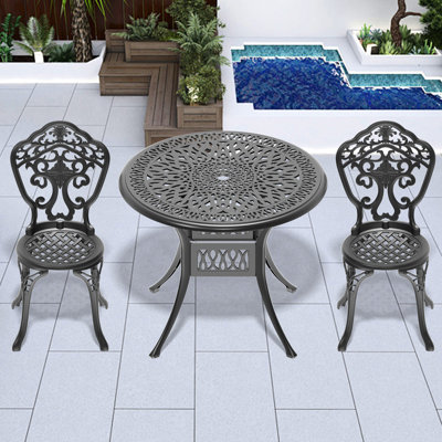 Ensemble de salle à manger 3 places en aluminium moulé avec structure noire. Style élégant et robustesse. Revêtement résistant aux intempéries et antidérapant. Montage facile. Mobilier tout le temps. Artisanat traditionnel, confort moderne. Résistant aux conditions difficiles.