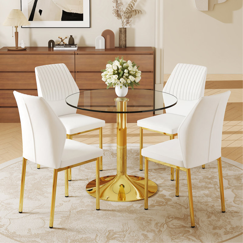 Ensemble de table et de chaises.Une table de salle à manger ronde en verre trempé transparent de 35 po - Support et base en métal doré.