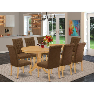 L'ensemble de mobilier de salle à manger 9 pièces comprend une table de cuisine ovale en forme de papillon et 8 chaises rembourrées en tissu de lin brun, chêne