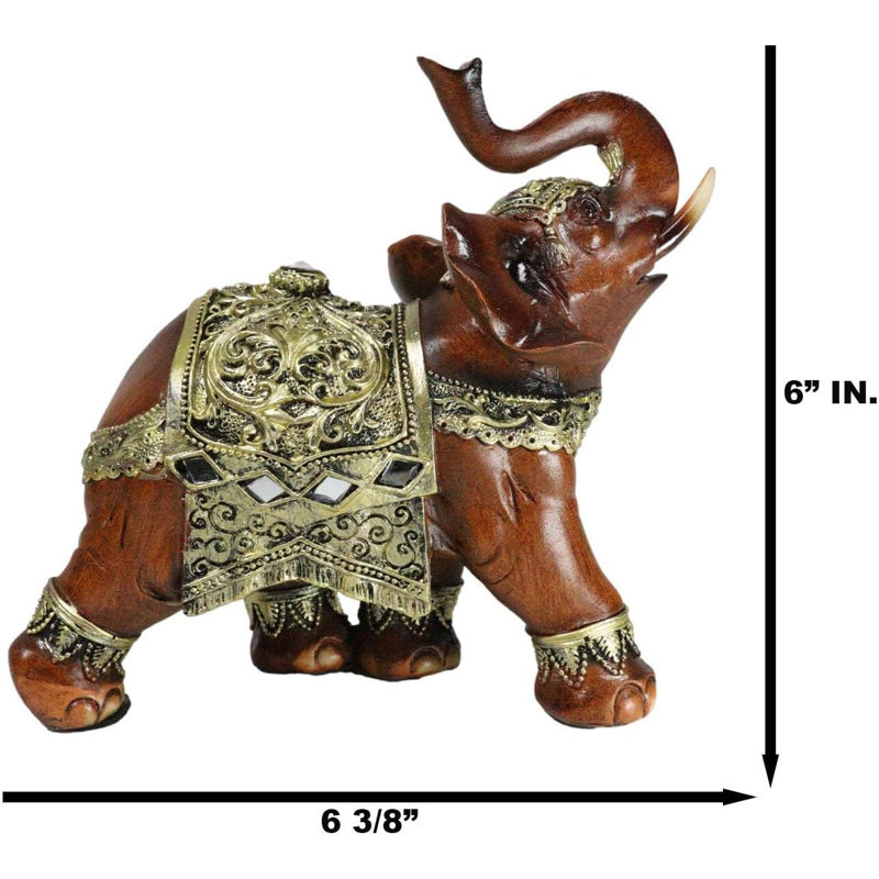 Figurine éléphant en faux bois avec volutes dorées et miroirs en verre
