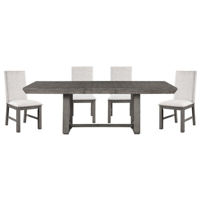 Salle à manger rustique 5 pièces : table rectangulaire grise avec rallonge et 4 chaises texturées, tissu orné de clous décoratifs