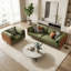 Fauteuil moderne à assise profonde avec revêtement vert olive et accoudoirs bouclés orange