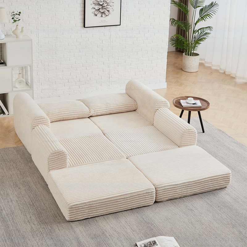 Canapé minimaliste en velours côtelé avec lignes courbes et dossier légèrement incliné, canapé 2 en 1 et lit, comprend deux coussins décoratifs