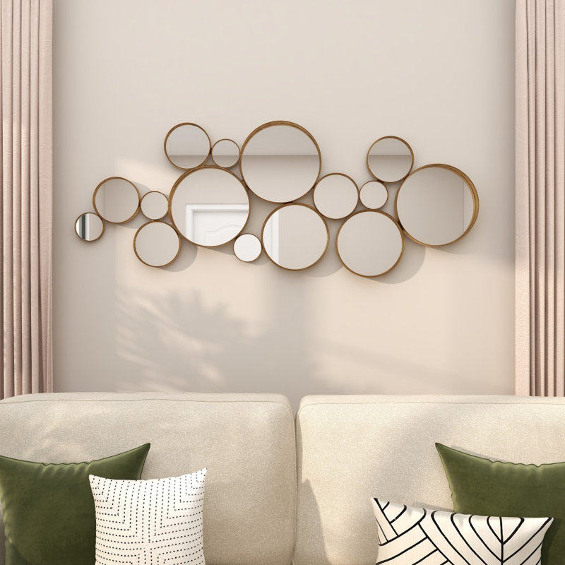 Miroir mural rond en métal doré
