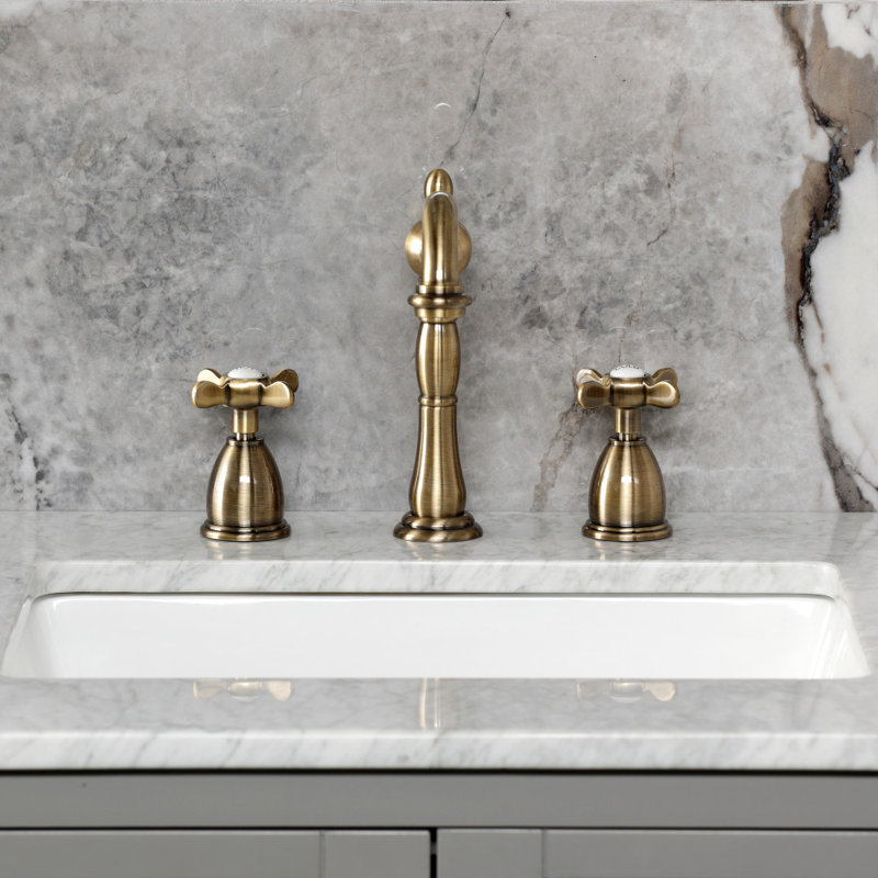 Kingston Brass Essex Two-Handle 3-Hole Deck Mount Widespread Bathroom Faucet with Pop-Up Drain, Antique Brass
