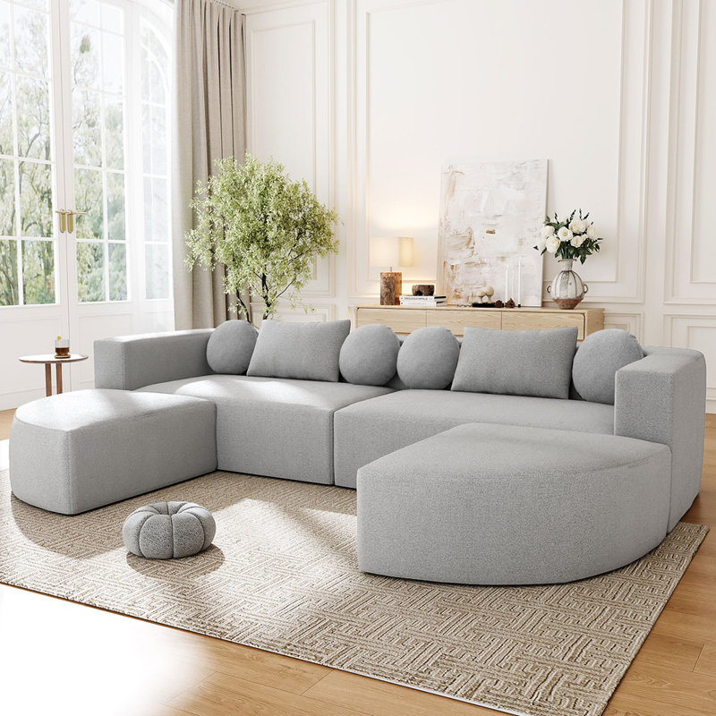 Canapé modulaire modulaire à assise profonde et design incurvé pour des agencements de salon flexibles, Gris