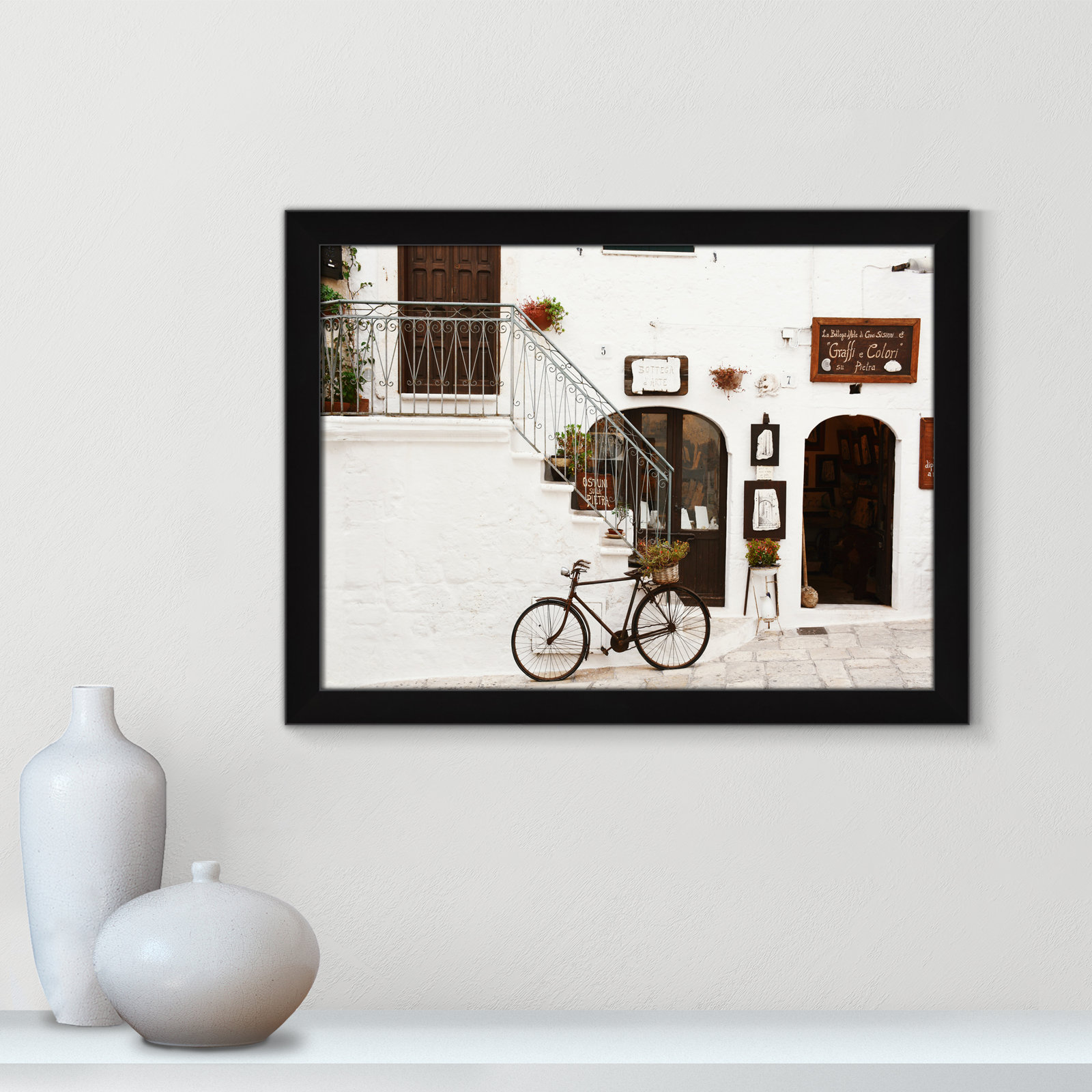 Em "La Bottega d'Arte" Print by Bogdan Dada, 18" H x 24" W x 0.75" D, Black Framed